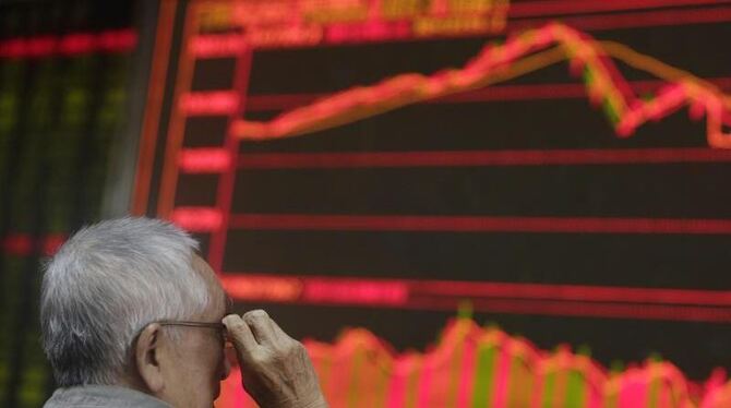 Die Börsen in China sind erst vor kurzem abgesackt. Nun werden Sündenböcke dafür präsentiert, Foto: How Hwee Young