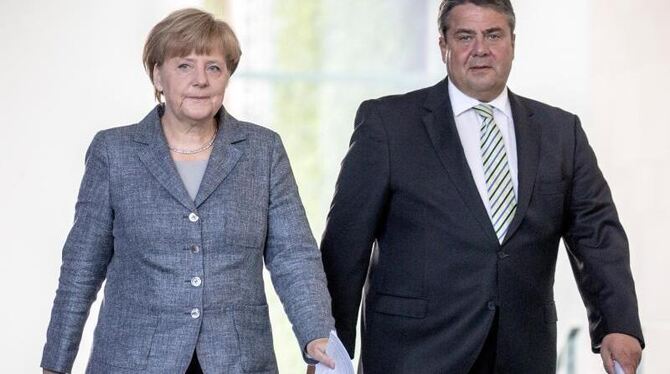 Wie reagiert die SPD um Parteichef Sigmar Gabriel auf die Ankündigung von Kanzlerin Angela Merkel? Foto: Michael Kappeler