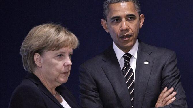 Kanzlerin Merkel und US-Präsident Obama beim Gipfel in Cannes. Foto: Guillaume Horcajuelo