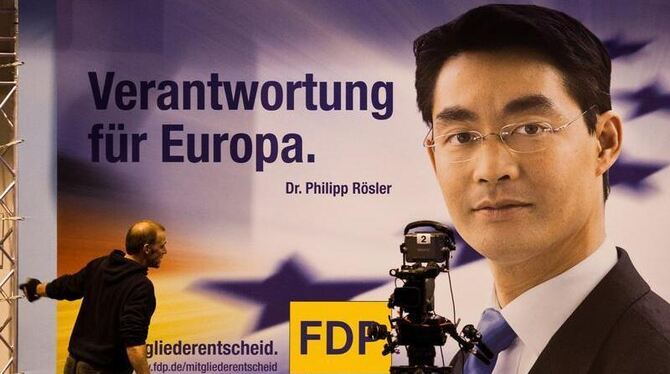 Plakat mit dem Bild von Parteichef Philipp Rösler beim Außerordentlichen Bundesparteitag der FDP. Foto: Michael Kappeler