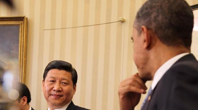 US-Präsident Barack Obama mit dem damaligen chinesischen Vizepräsidenten Xi Jinping im Weißen. Foto: Martin H. Simon/Archiv