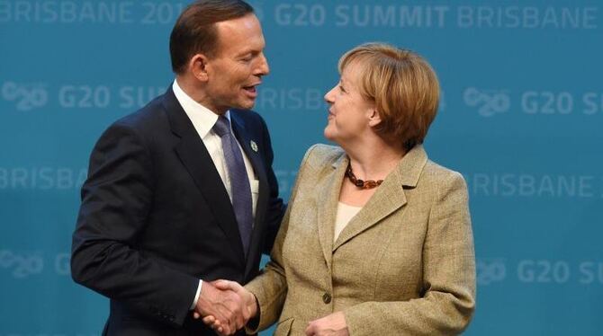 Der australische Premierminister Abbott und Bundeskanzlerin Merkel begrüßen sich beim G20-Gipfel. Foto: Lukas Coch