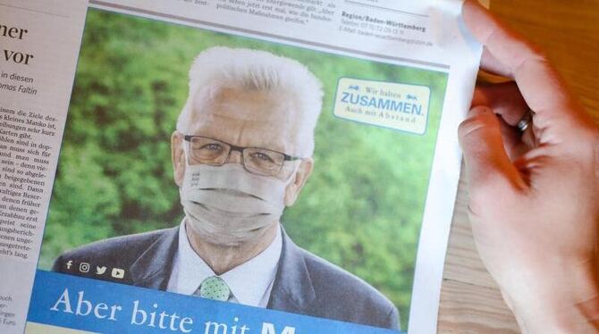 Das Abbild von Ministerpräsident Kretschmann in einer Zeitung