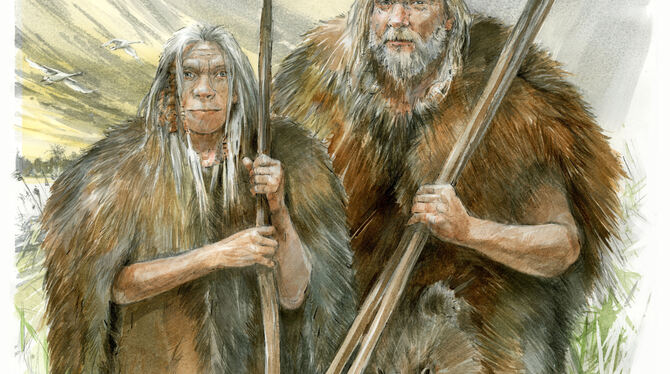 Homo Heidelbergensis-Paar, das Felle von Höhlenbären zum Schutz vor Kälte trägt. Der Bär brauchte ein stark isolierendes Fell fü