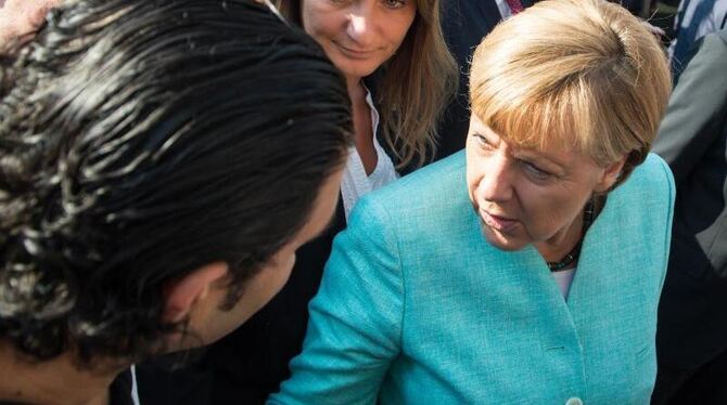 Harte Kritik aus Bayern: Angela Merkel muss in der Flüchtlingspolitik von der SPD gegen die CSU in Schutz genommen werden. Fo
