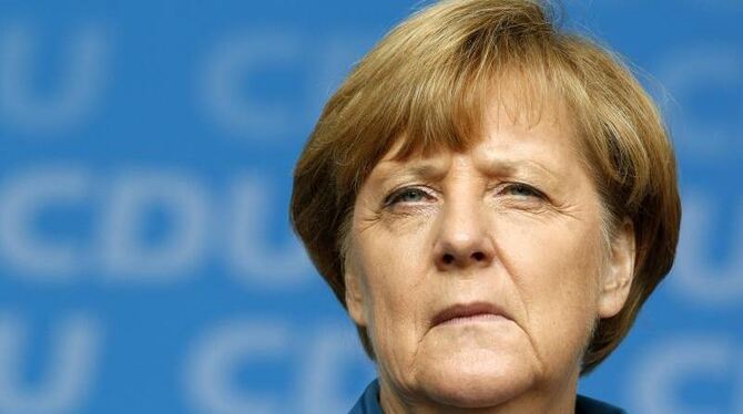 Angela Merkel wird beim G20-Gipfel in China den türkischen Präsidenten Erdogan treffen. Foto: Roland Weihrauch/Archiv