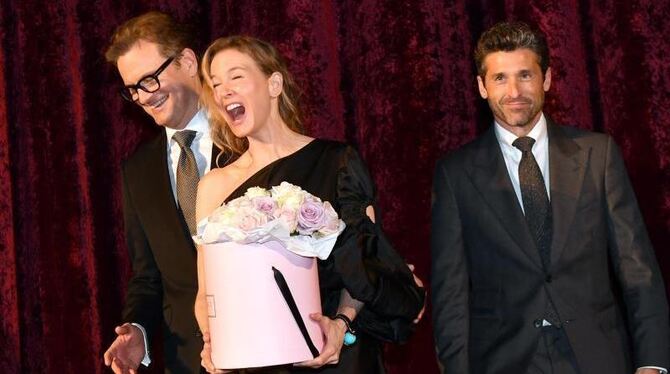 Colin Firth (l) und Renée Zellweger haben Spaß. Und Patrick Dempsey? Foto: Jens Kalaene